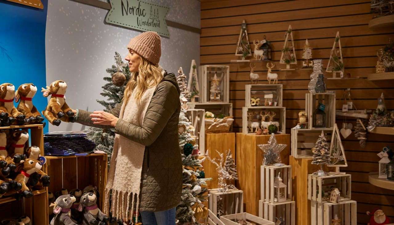 A woman looking in the Christmas shop