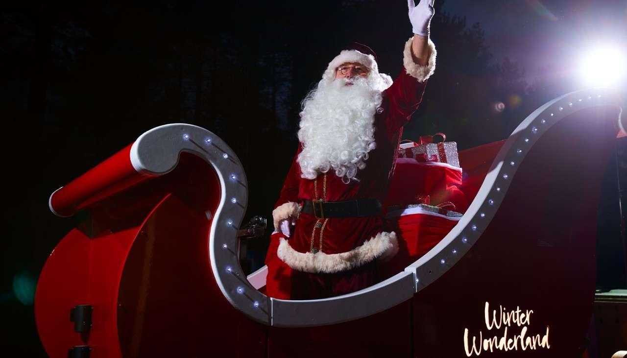 Santa waving on his sleigh.