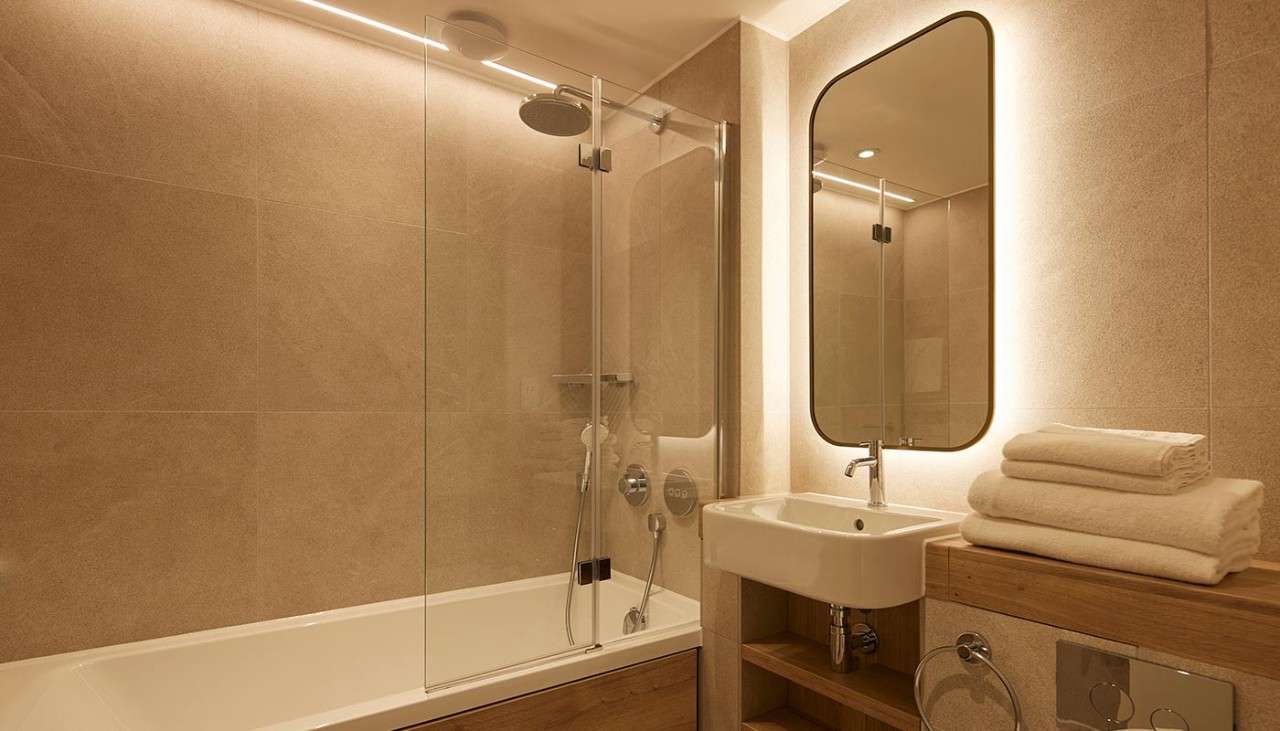 Bathroom with bath and built in shower.