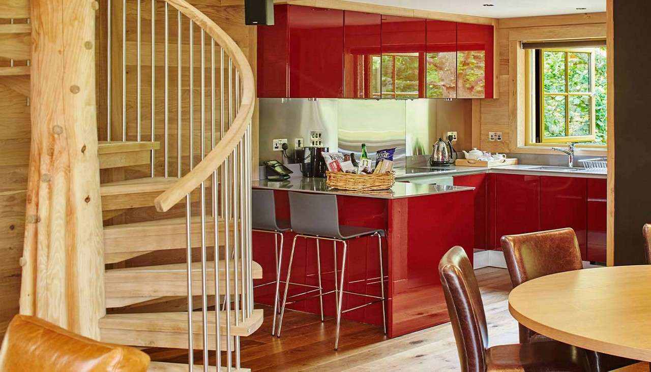 A kitchen in a Treehouse with a spiral staircase 