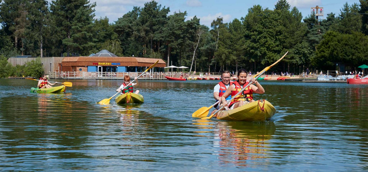 A family kayaking on the lake.