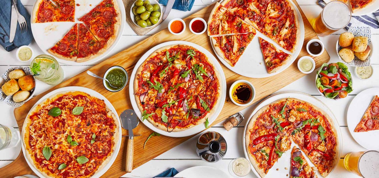 Plates of pizza on a table