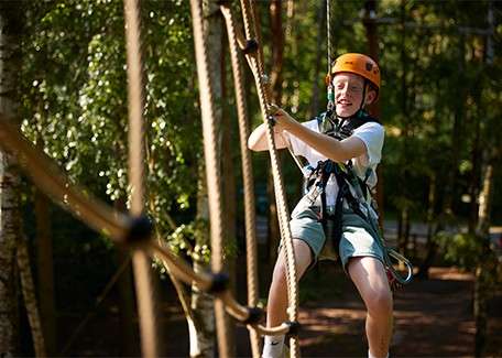 A boy on Aerial Adventure.
