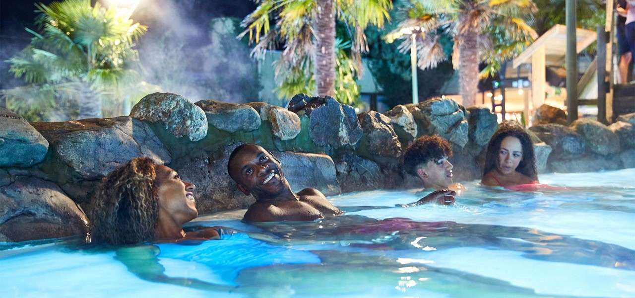 A mother and her teenage sons in The Subtropical Swimming Paradise.