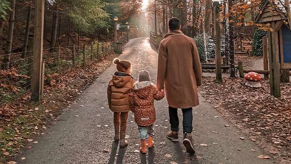 A family walking through the forest