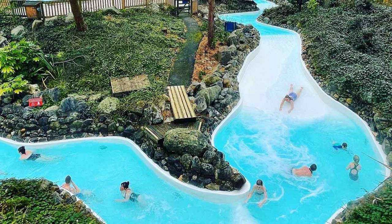 An aerial view of guests whizzing down the Wild Water Rapids in the Subtropical Swimming Paradise. 