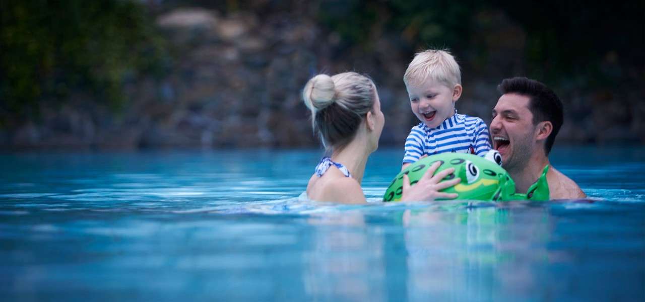 Family in Subtropical Swimming Paradise