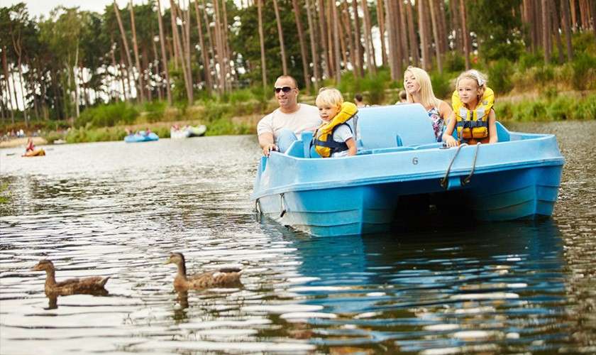 A family on a pedlo together.