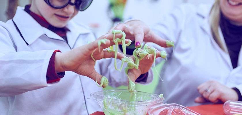 A child playing with slime.