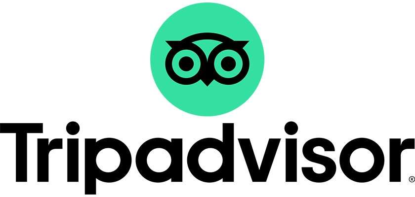 Stylized owl logo inside a green circle sits above the black wordmark on a white background. Text: Tripadvisor ®.