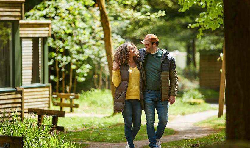 A couple walking through the forest