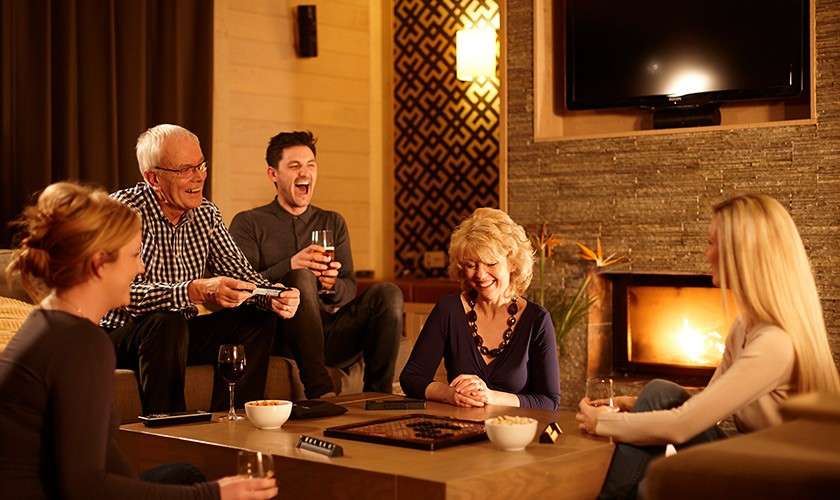 Family gathered around a coffee table