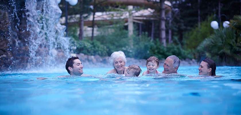 A family swimming together in the Subtropical Swimming Paradise.