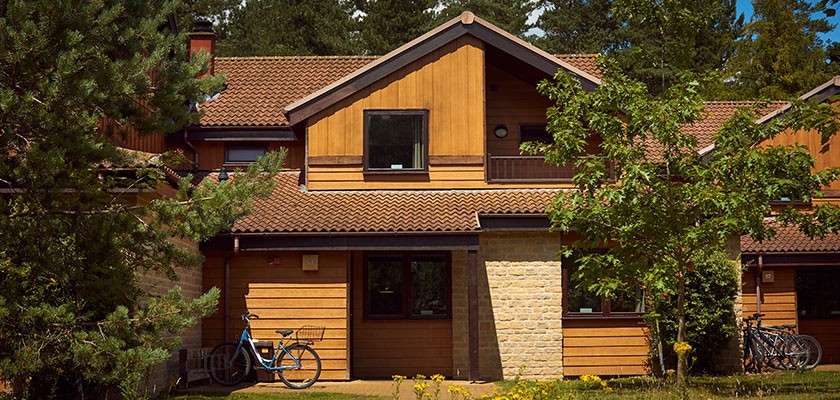 The external view of a lodge in the forest