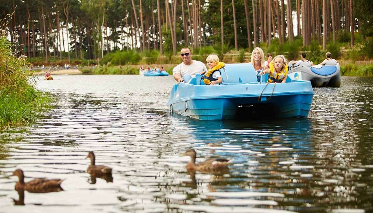 Family on a pedalo on the lake.