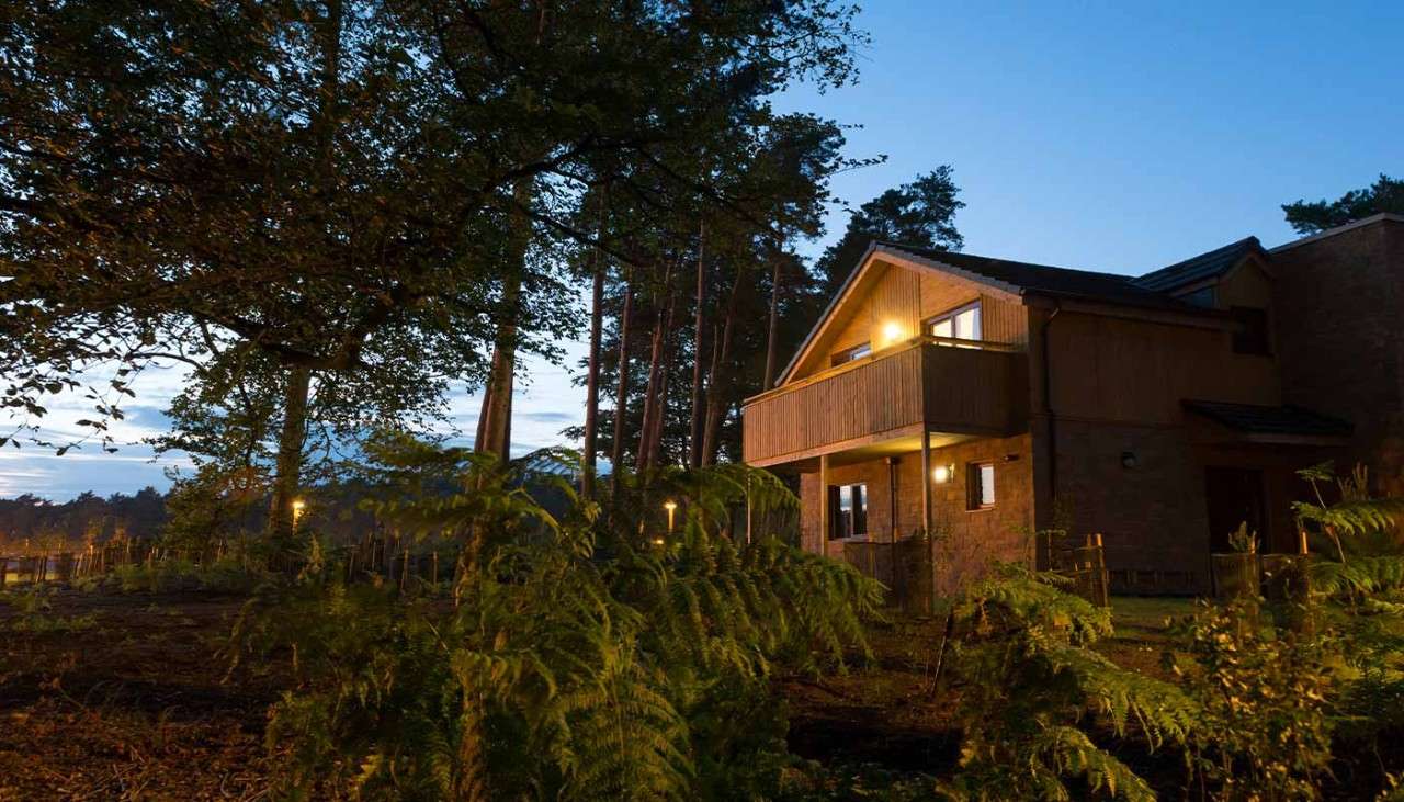 The exterior of an Exclusive Lodge at night time 