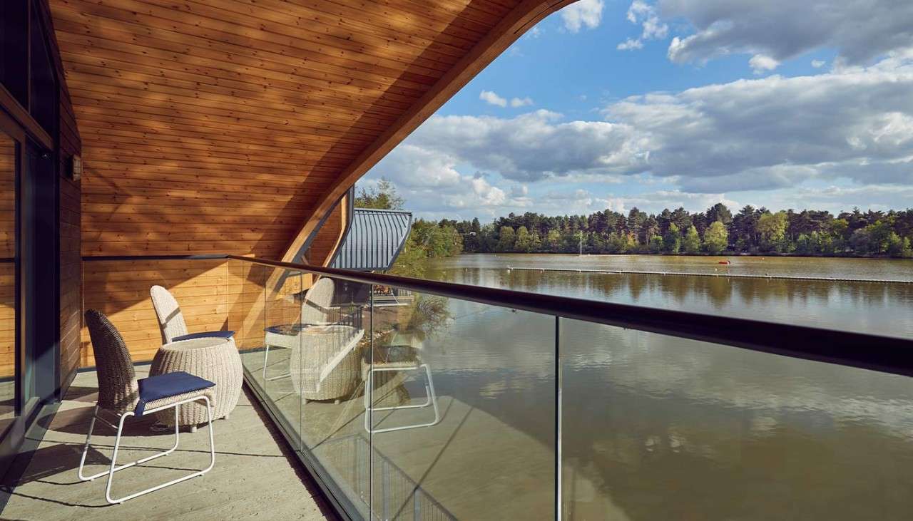 A balcony of a Waterside Lodge facing onto the lake 