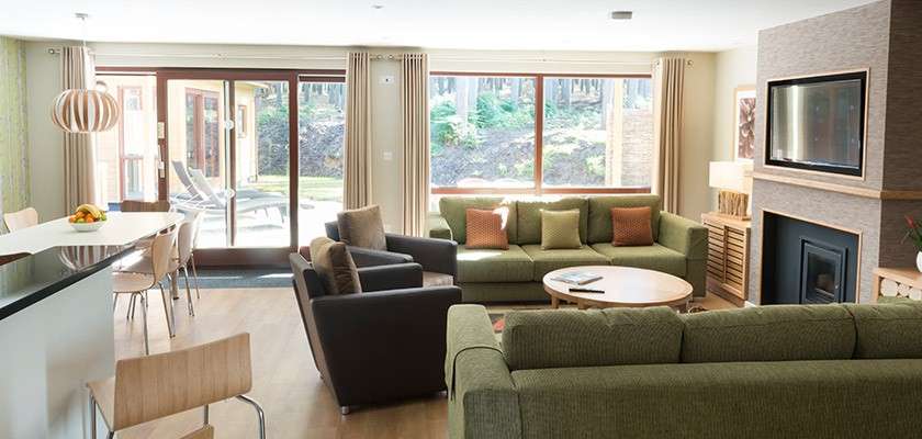 Exclusive lodge living room looking out onto patio area