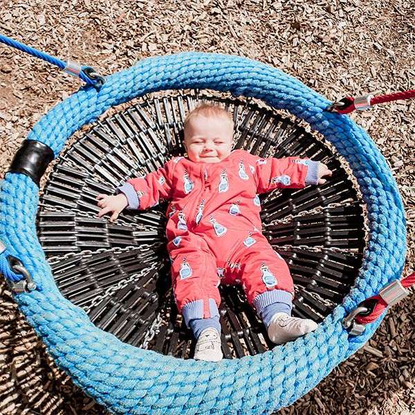 A toddler playing in the play area