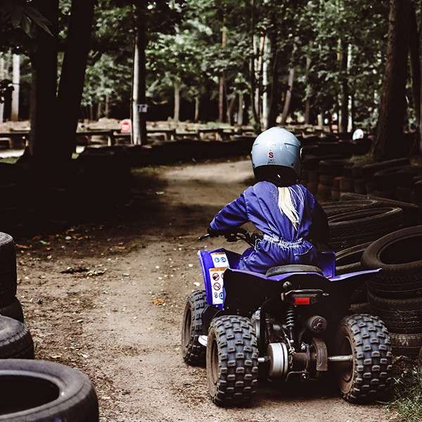 A young boy on a quad bike