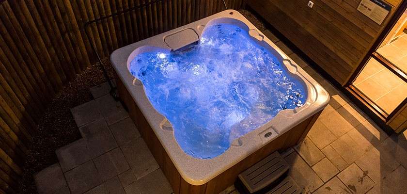 Private hot tub and sauna on patio area