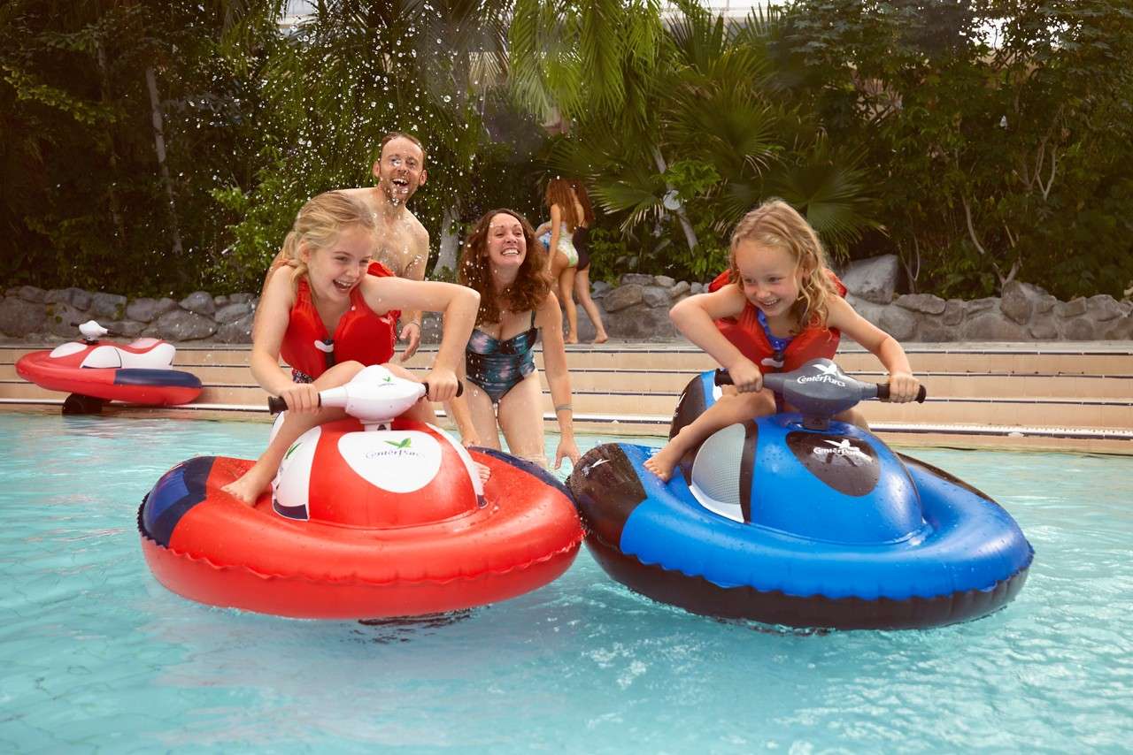 A young people riding Mini Jet Skis.