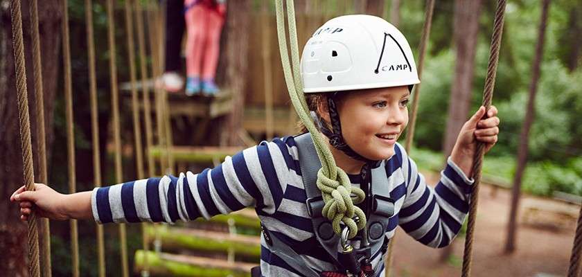 Young girl tackling the Aerial Tree Trekking