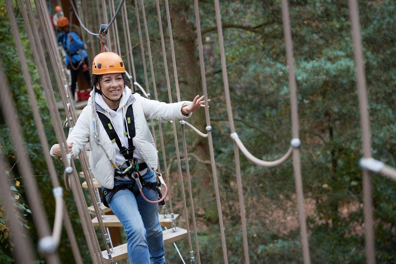 family completing aerial adventure