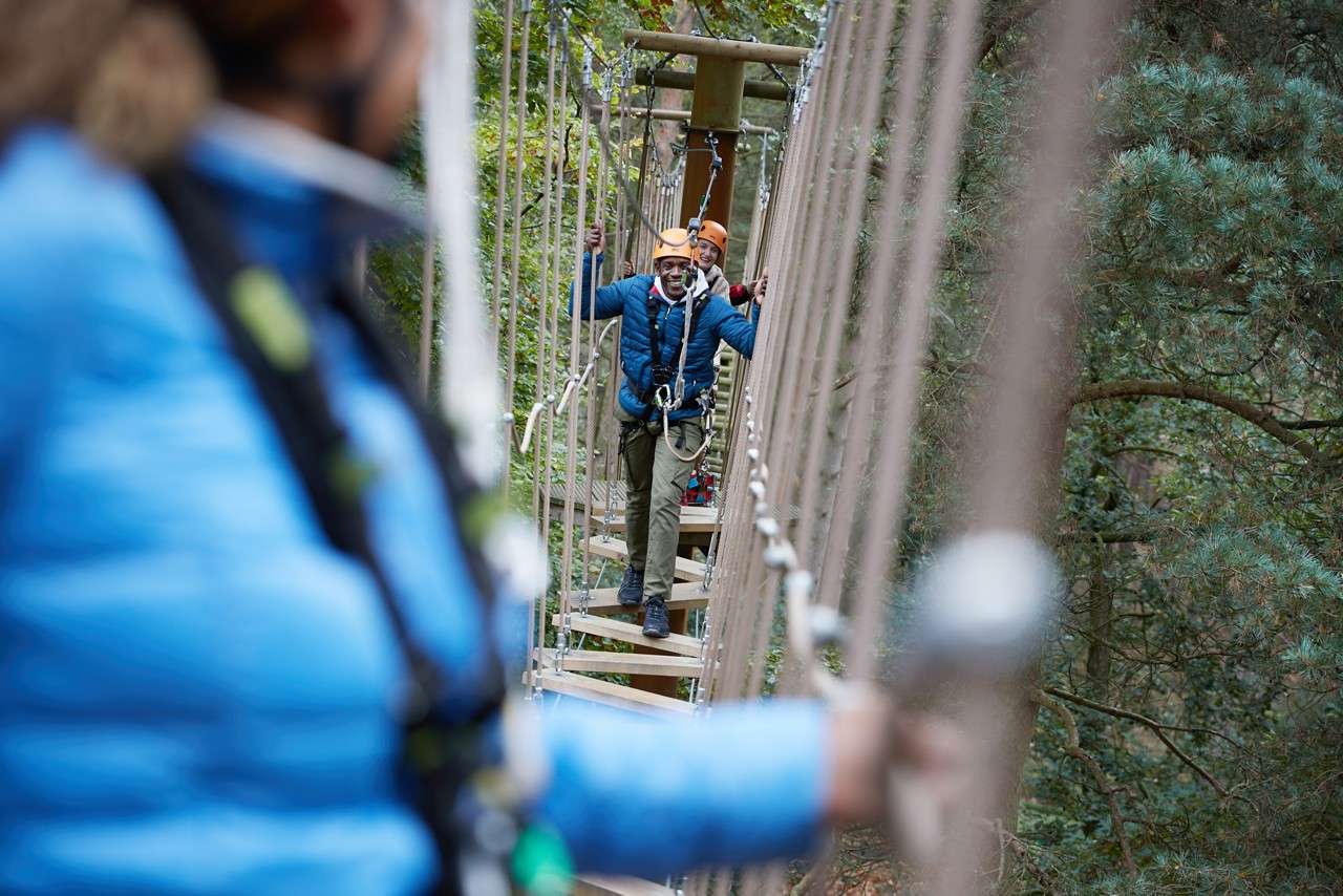 family completing aerial adventure