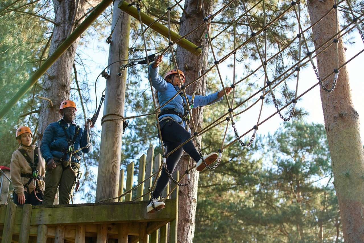 family completing aerial adventure
