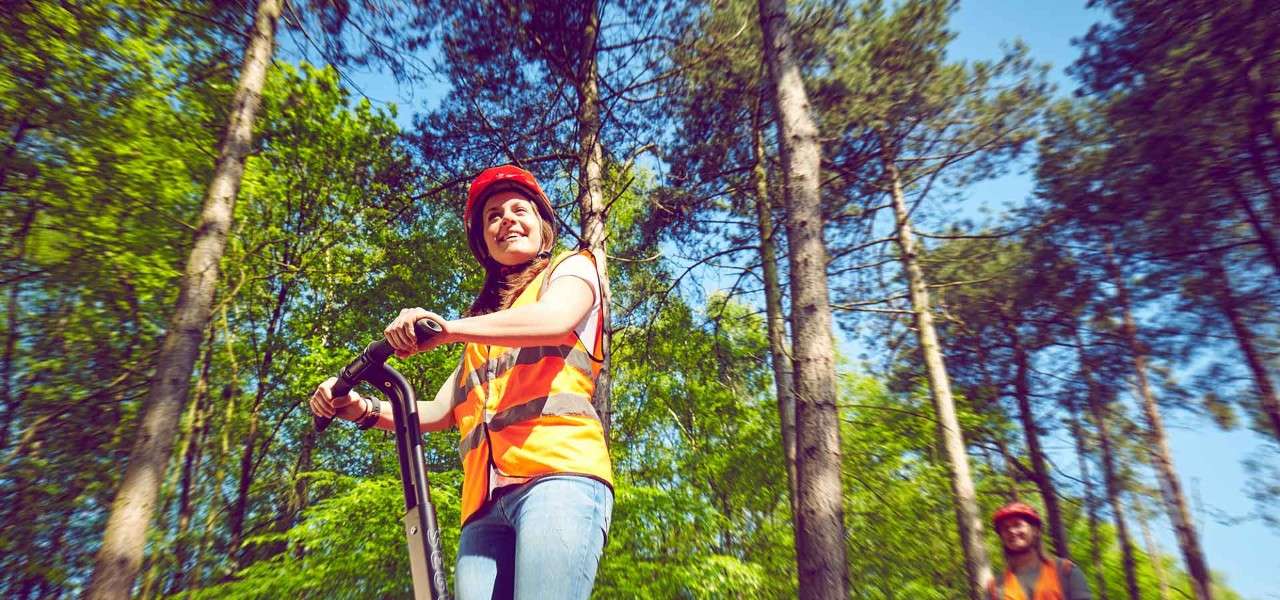 Girl on a segway in the forest