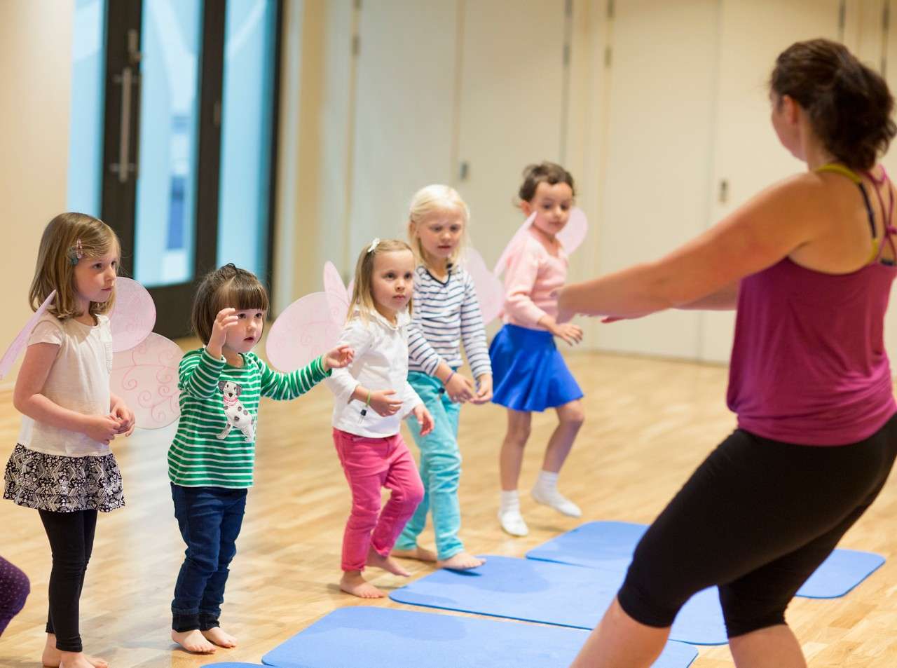 Young girls taking part in a ballet dance class.