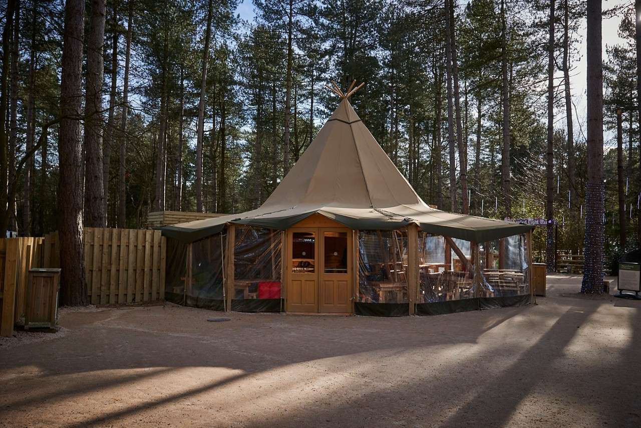 Young girl posting a letter to Santa.