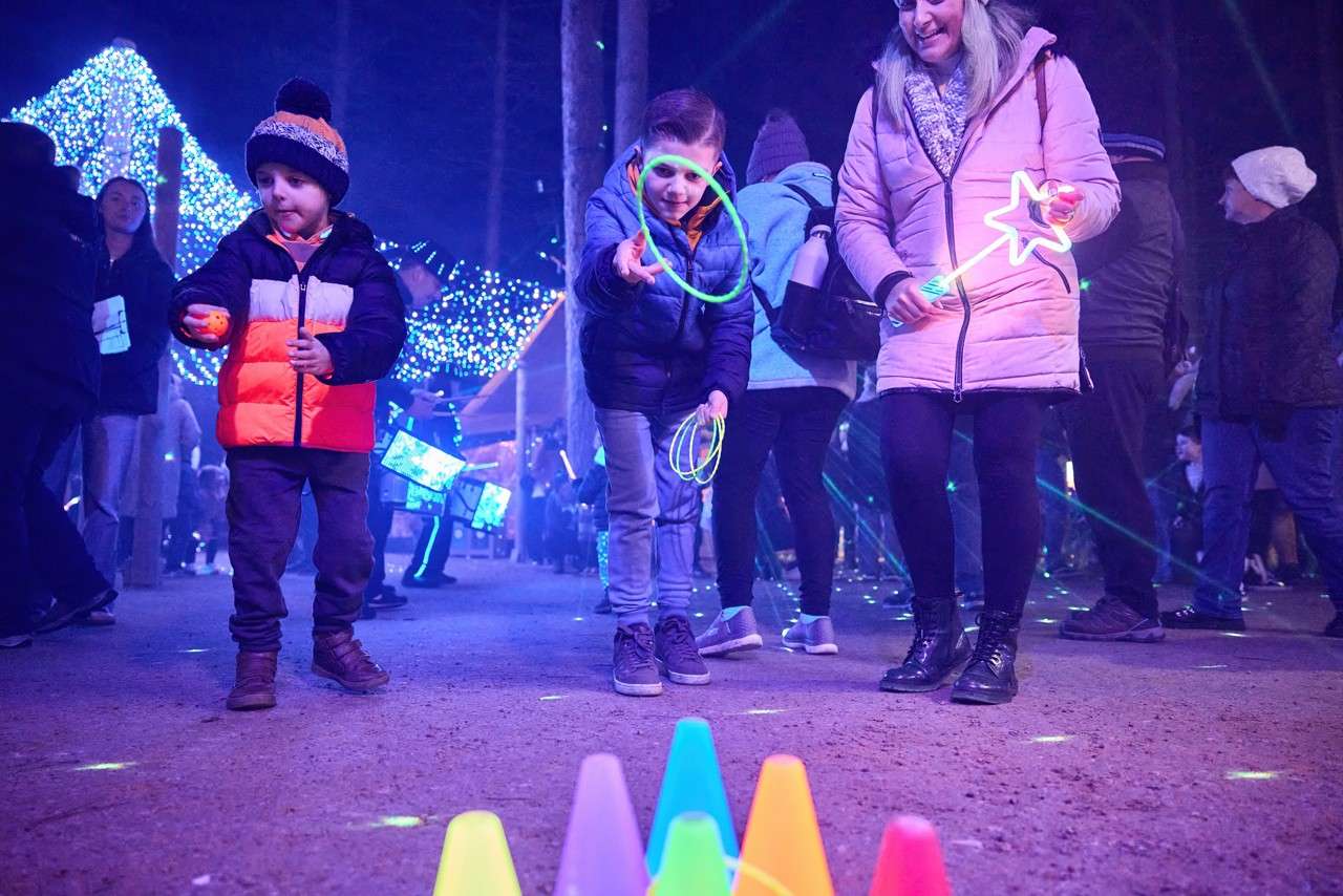 Children playing games with neon toys.