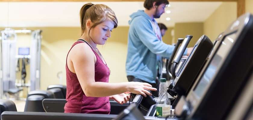 Woman using a treadmill in The Gym