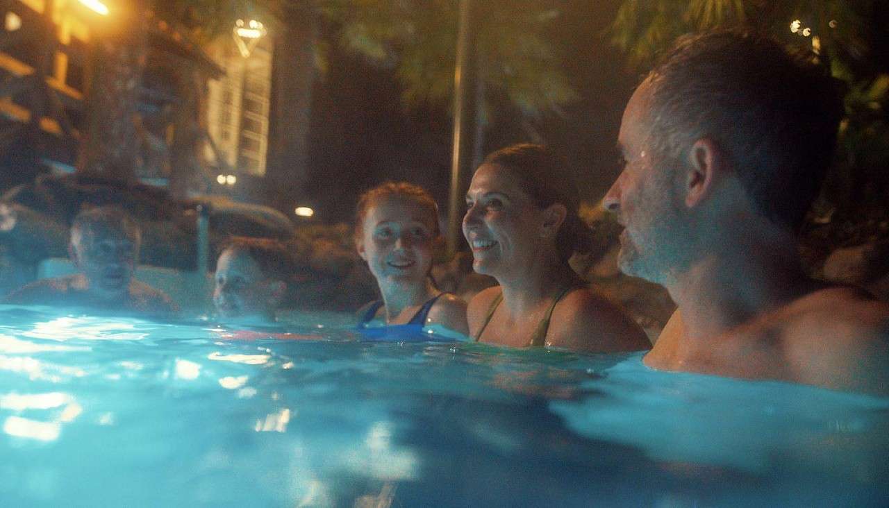 Family soaking in the Outdoor Sprudel Pool