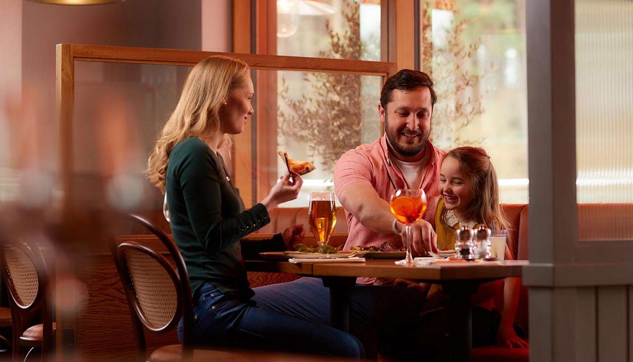 A family eating a pizza at Amalfi restaurant 