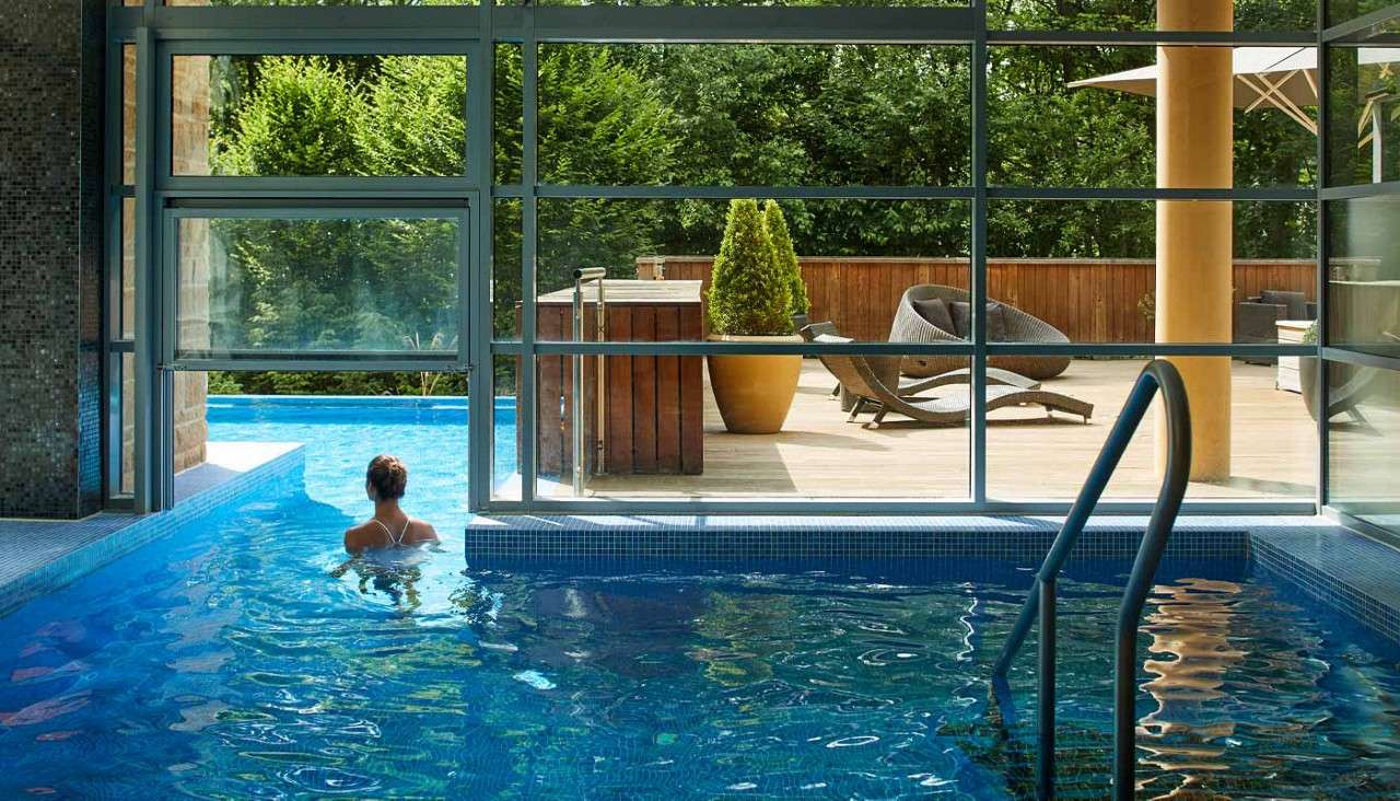 Outdoor pool surrounded by the forest.