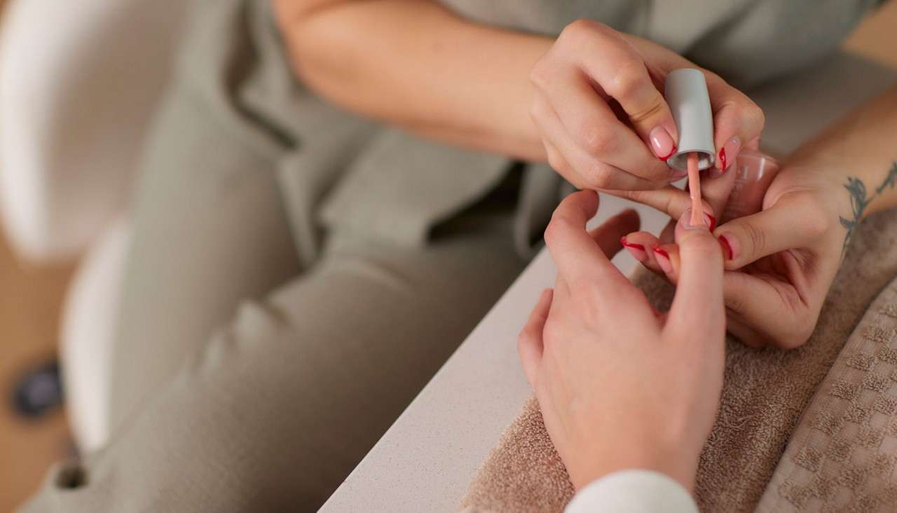 Woman having a manicure.