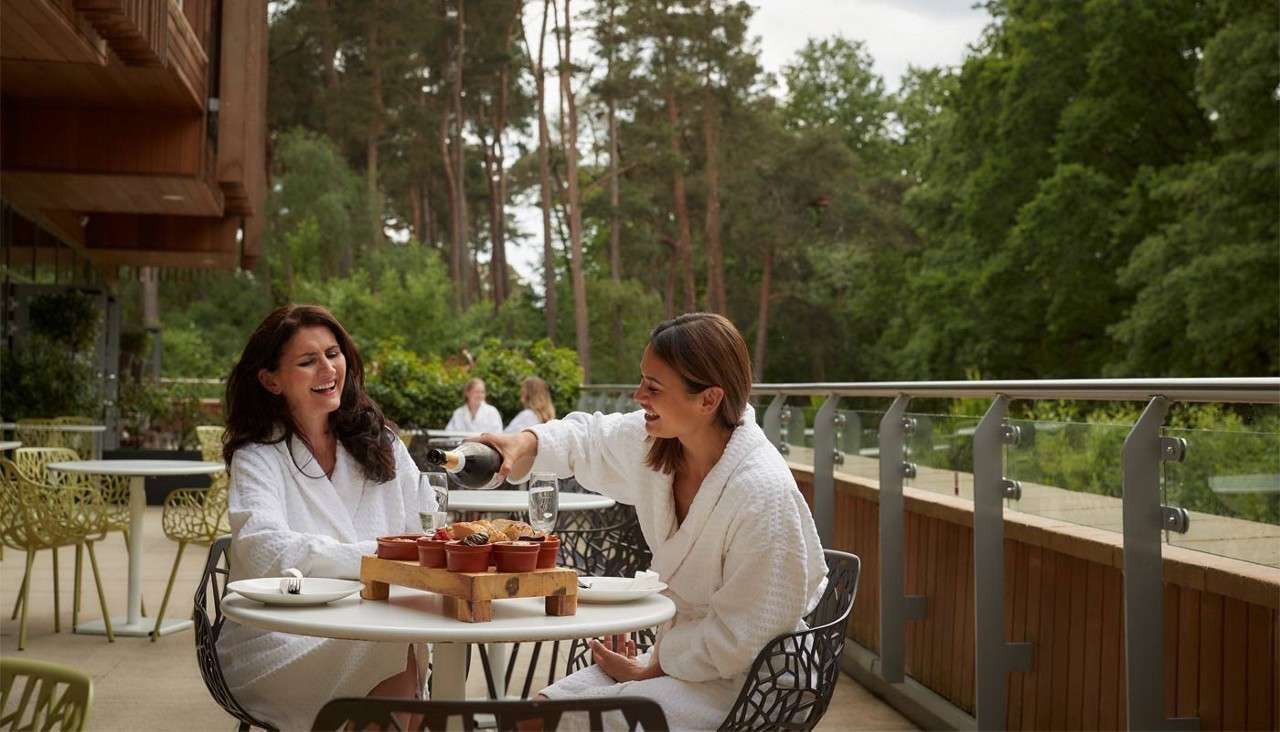 Two women sitting on the outdoor terrace of the Vitalé Café Bar
