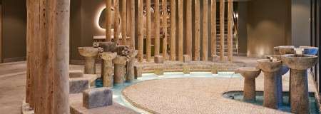 Stone footbaths with water fountain features.