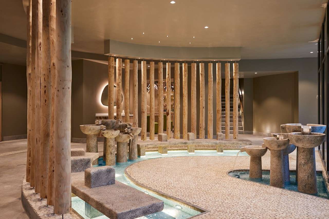 Curved wooden interior of the Sole Therapy room.
