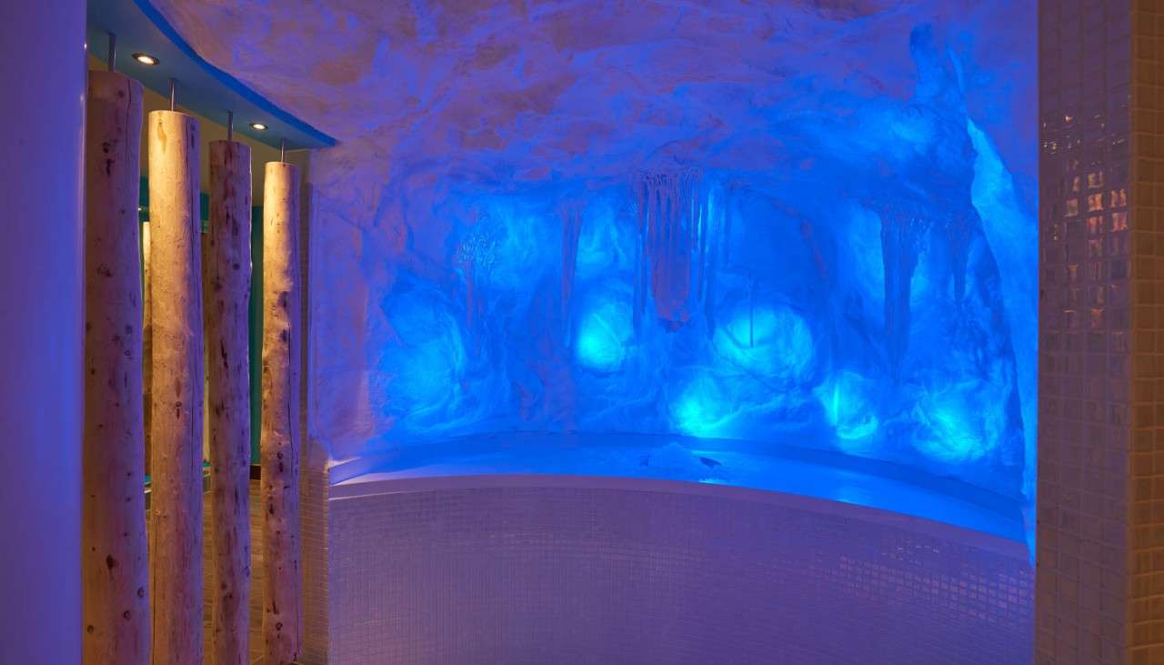 A glowing ice wall with a curved ledge.