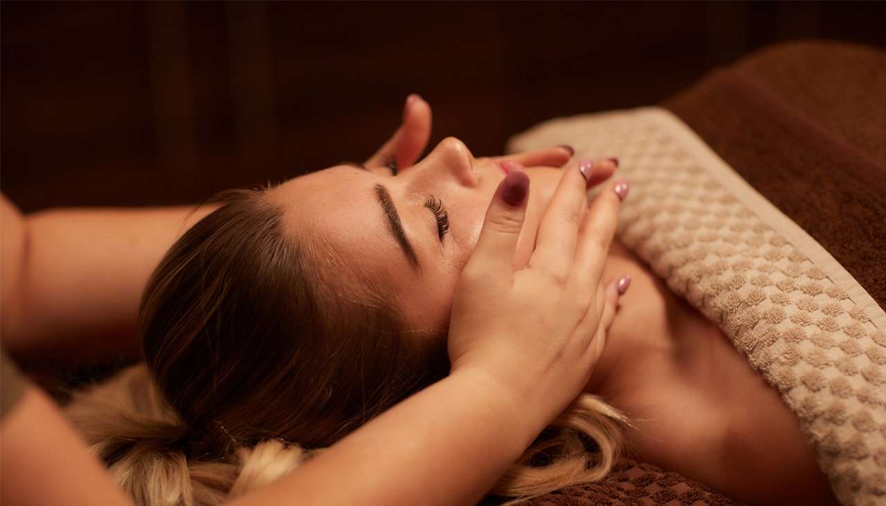 A woman having a face massage