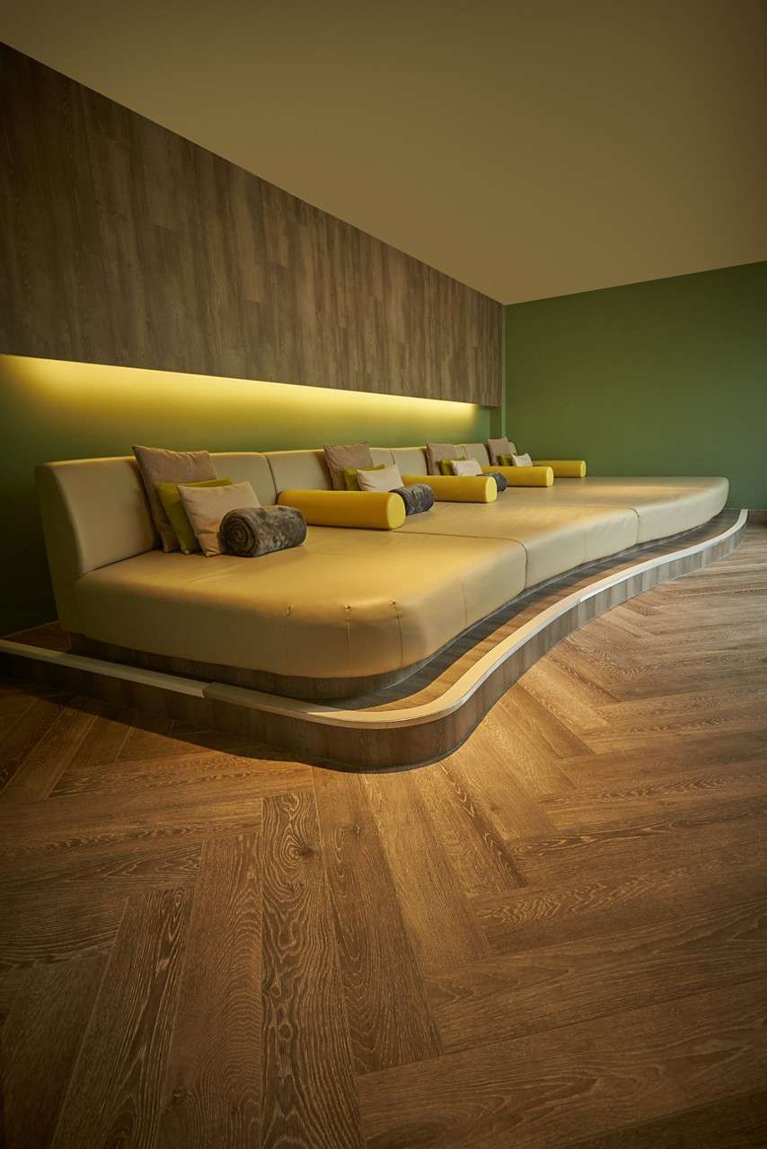 Cushioned lounging bed in the Forest View relax area.