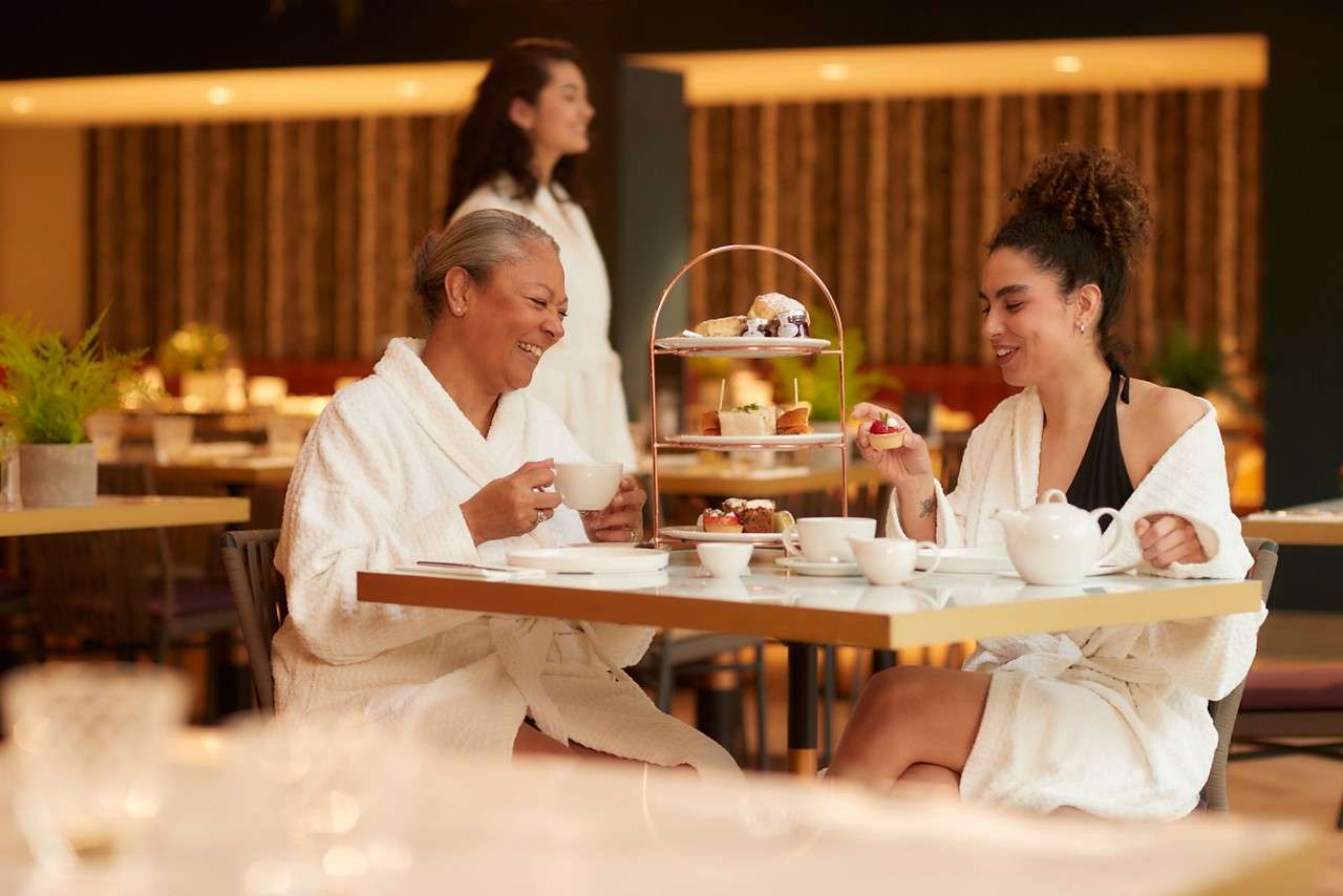 Two women having an Afternoon Tea.