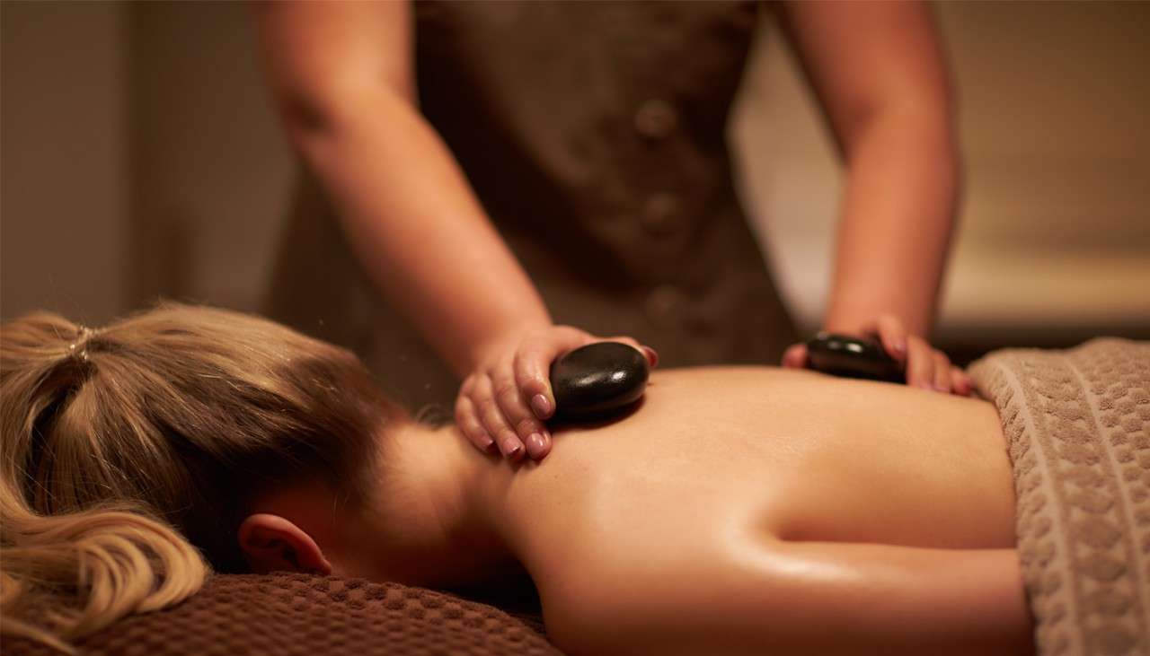 Woman receiving a full body Thermabliss Stone Massage