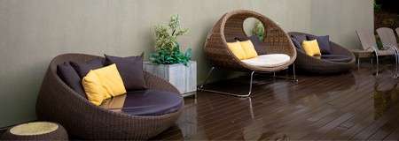 Comfortable egg chairs on an outdoor terrace.