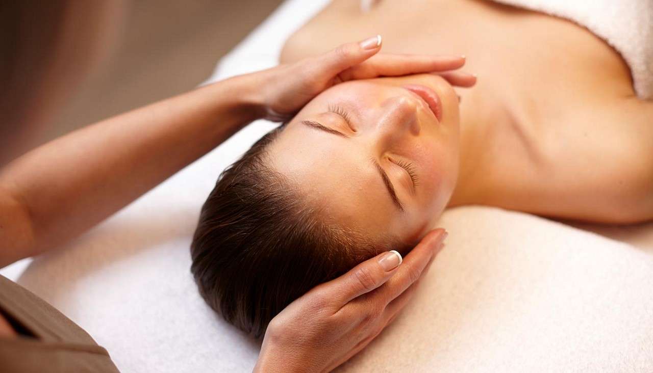 Woman receiving a facial.