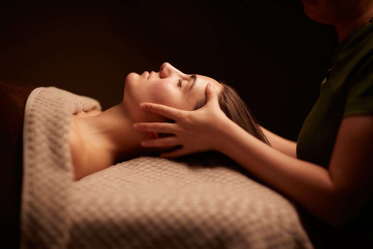 Woman having a relaxing facial treatment.